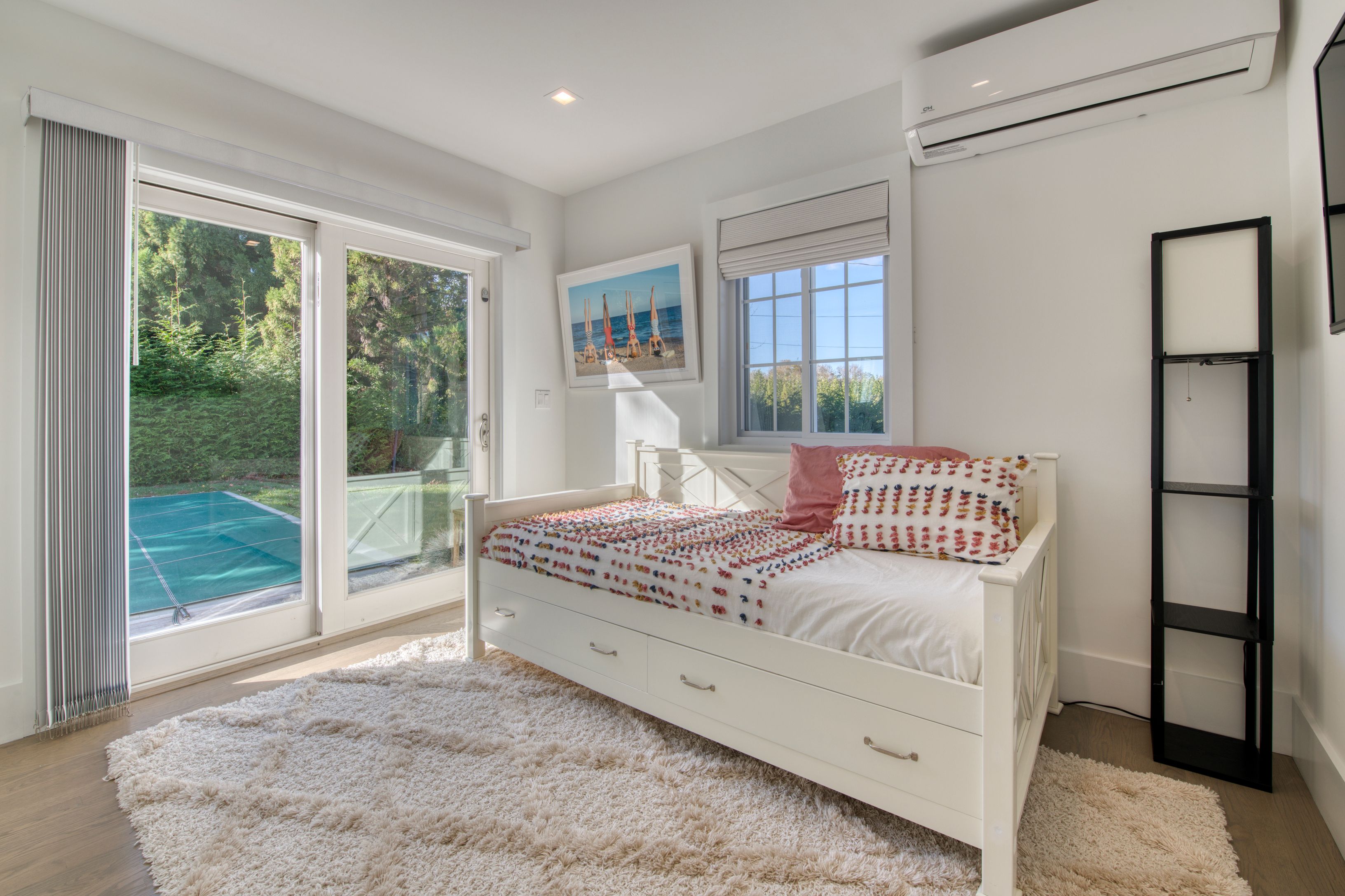 225 Oak Street Bridgehampton, NY 11932 - Photo 17 of 26 a bedroom with a bed and a large window