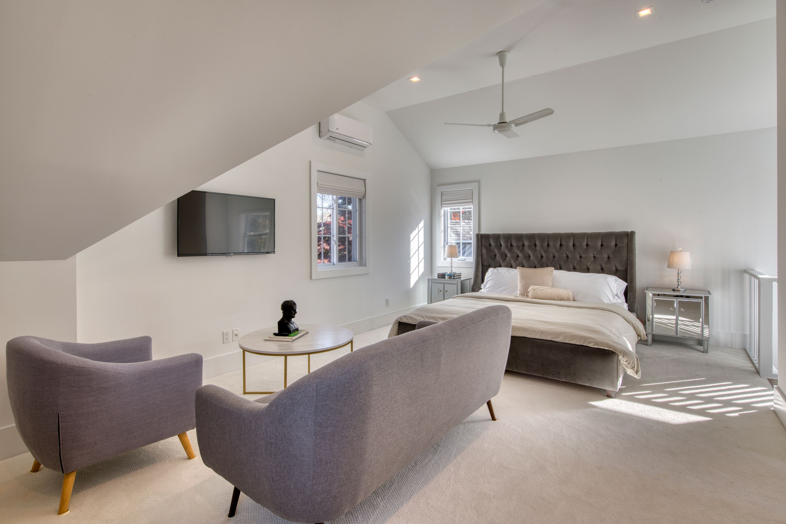 225 Oak Street Bridgehampton, NY 11932 - Photo 19 of 26 a bedroom with a bed and a couch