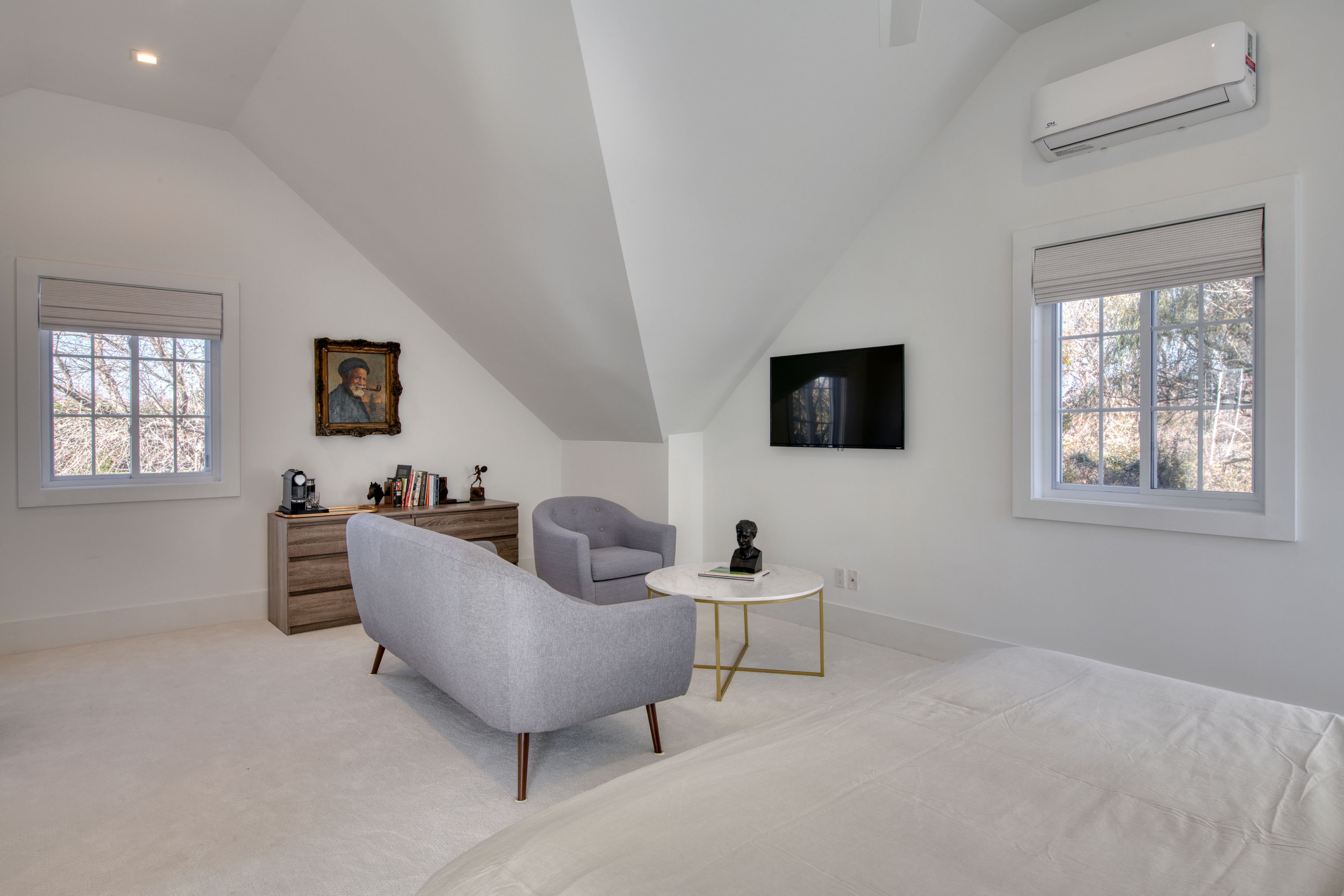 225 Oak Street Bridgehampton, NY 11932 - Photo 20 of 26 a living room with furniture and a flat screen tv
