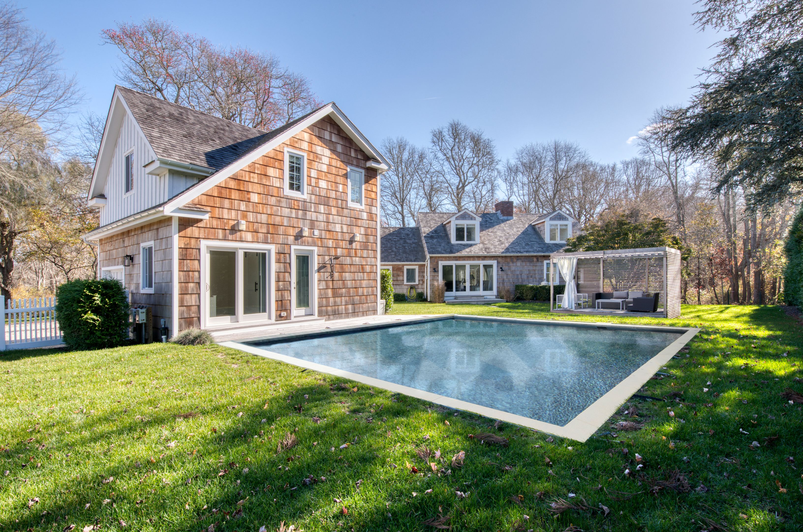 225 Oak Street Bridgehampton, NY 11932 - Photo 2 of 26 a view of a house with swimming pool and sitting area