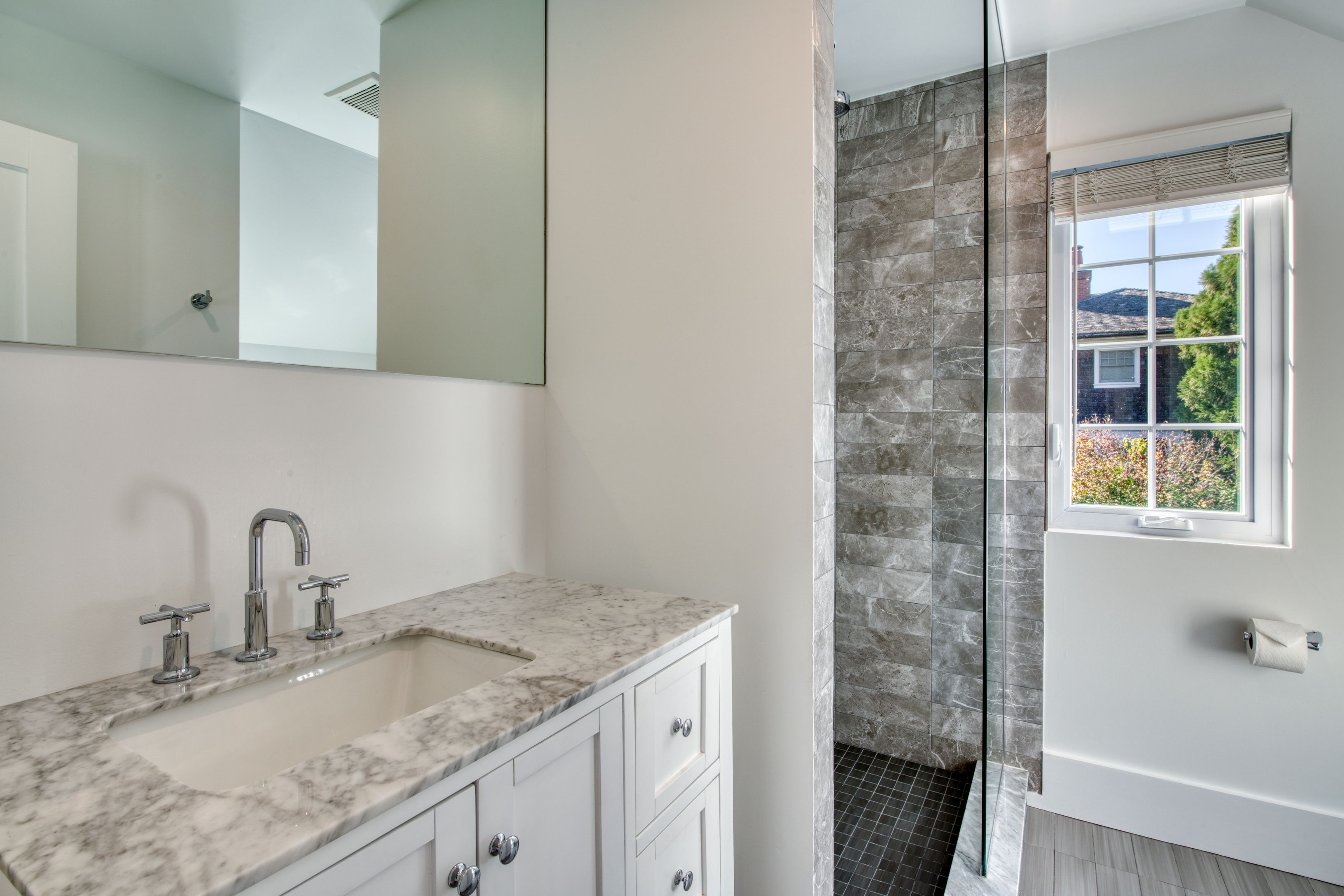 225 Oak Street Bridgehampton, NY 11932 - Photo 21 of 26 a bathroom with a granite countertop sink and a mirror