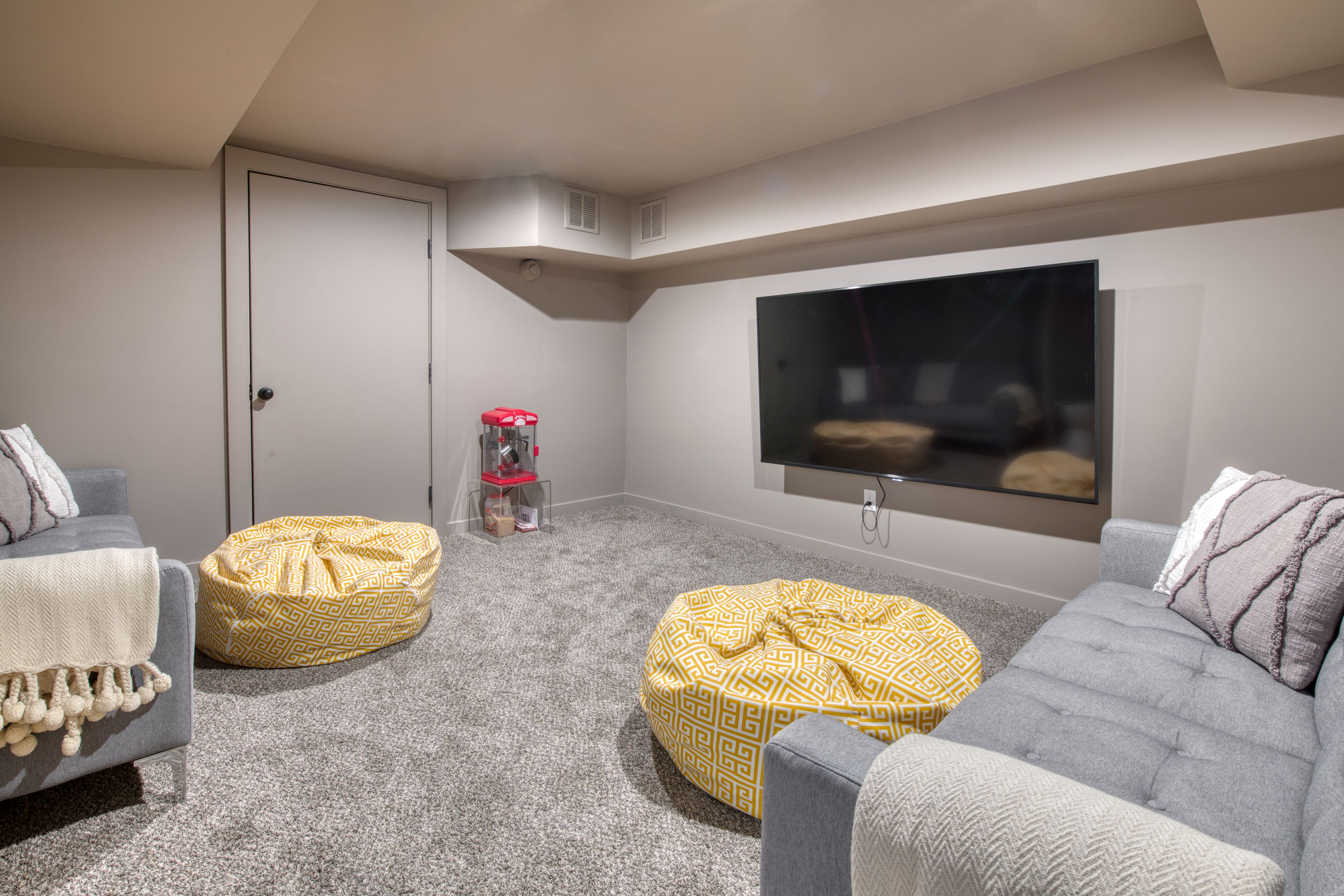 225 Oak Street Bridgehampton, NY 11932 - Photo 22 of 26 a living room with furniture and a flat screen tv