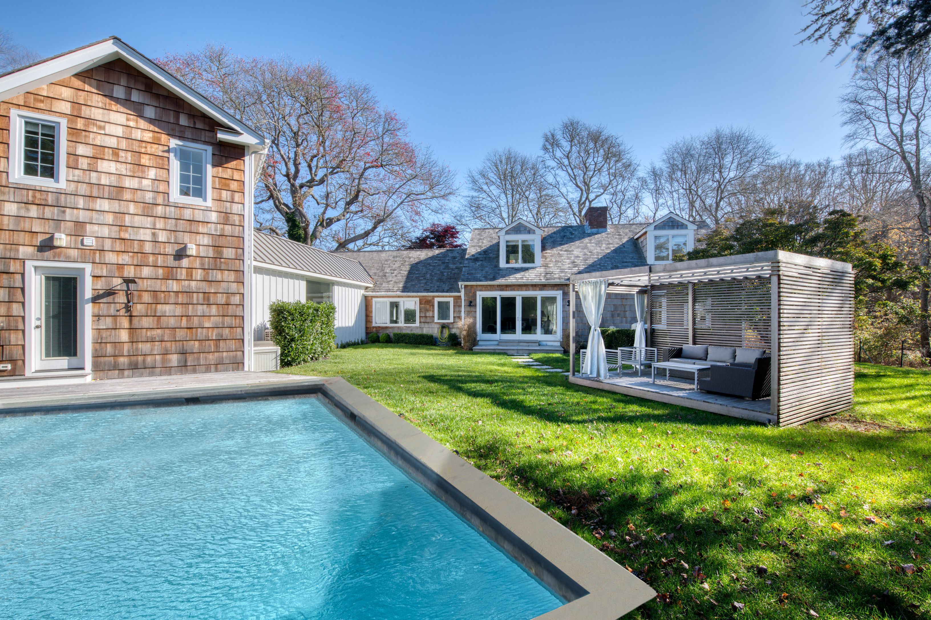 225 Oak Street Bridgehampton, NY 11932 - Photo 24 of 26 a view of house with a big yard potted plants and large tree