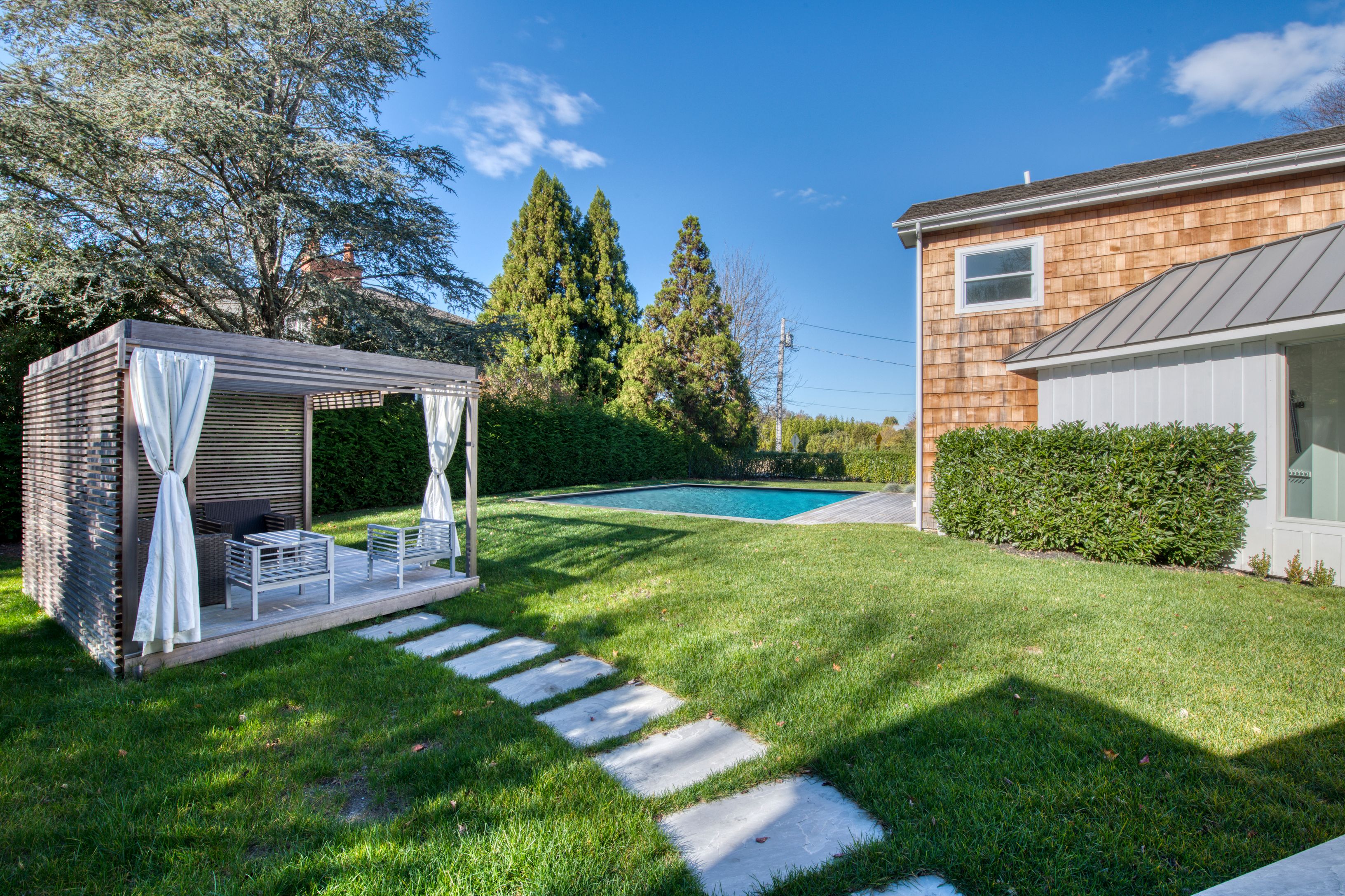 225 Oak Street Bridgehampton, NY 11932 - Photo 25 of 26 a view of a house with backyard and a garden