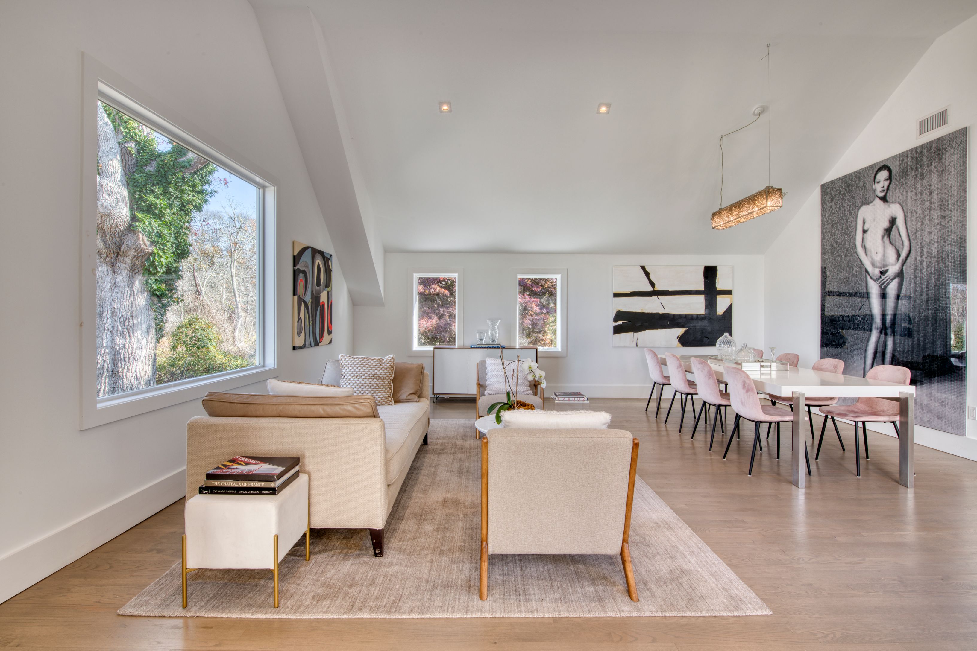 225 Oak Street Bridgehampton, NY 11932 - Photo 6 of 26 a living room with furniture a flat screen tv and a large window