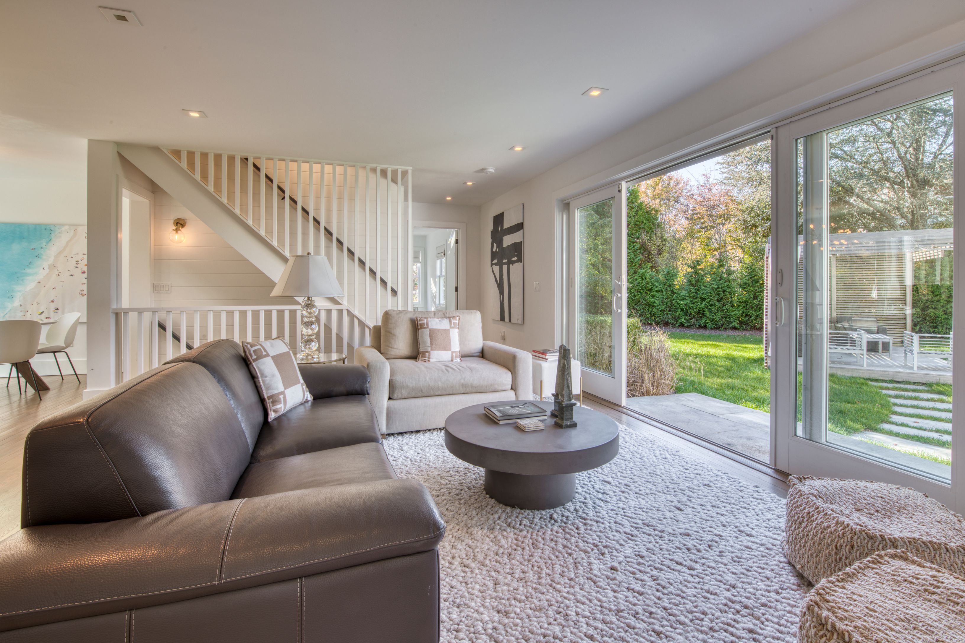 225 Oak Street Bridgehampton, NY 11932 - Photo 7 of 26 a living room with furniture and a large window