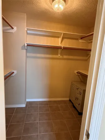 a bathroom with a shower and a mirror