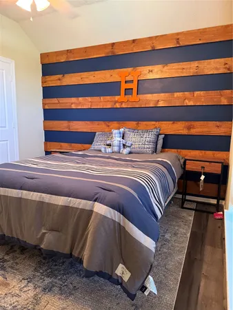 a bathroom with a granite countertop toilet and a sink