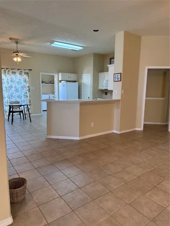a kitchen with stainless steel appliances a refrigerator sink and cabinets
