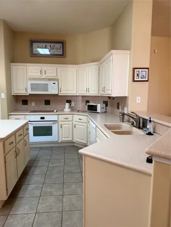 a view of storage and utility room with empty racks