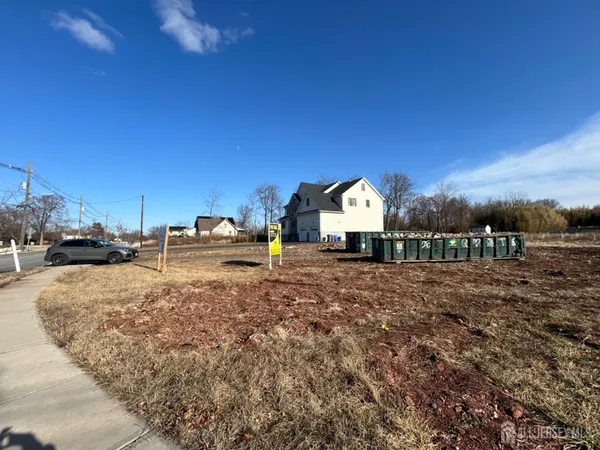 a view of multiple houses with a yard