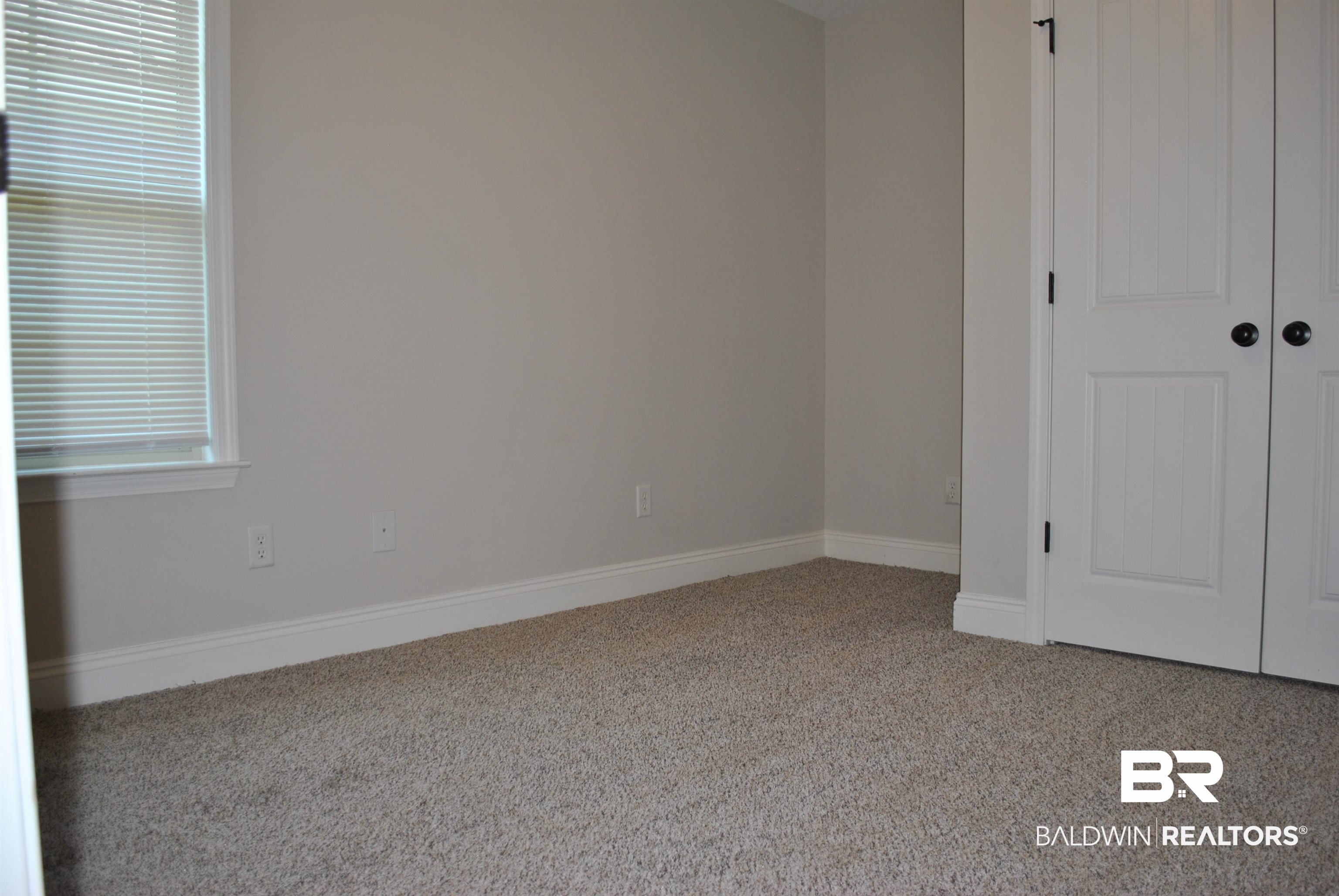 2161 Spring Grove West Mobile, AL 36695 - Photo 24 of 31 Unfurnished bedroom featuring carpet floors and a closet