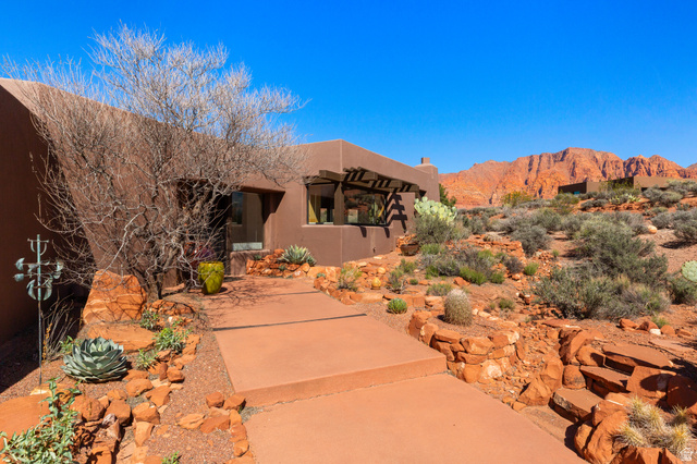 989 Shonto Ridge Drive Ivins, UT 84738 - Photo 1 of 1 View of front of house with stucco siding and a mountain view