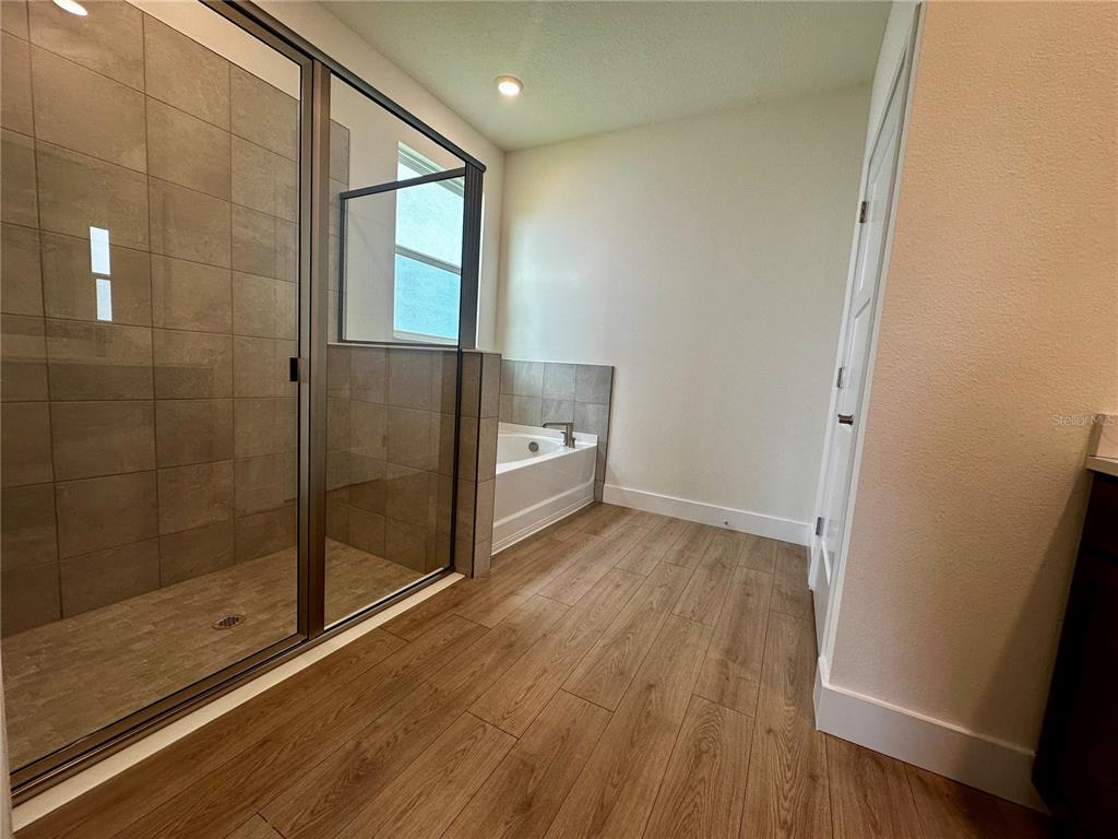 4281 Southwest 52nd Lane Road Ocala, FL 34474 - Photo 22 of 26 a hallway with wooden floor and window