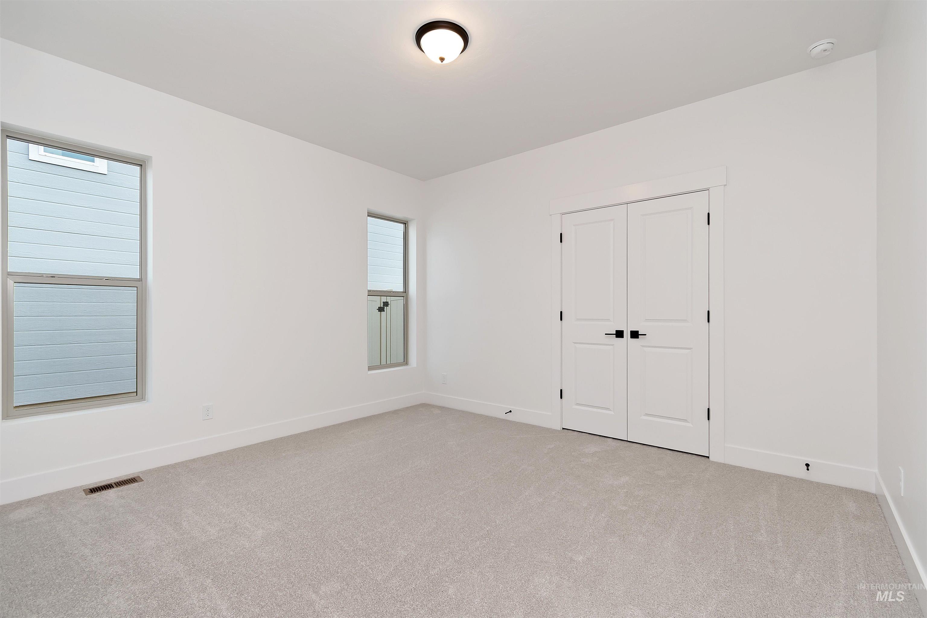 4302 Tropic Way Caldwell, ID 83607 - Photo 26 of 32 Unfurnished bedroom with carpet flooring and a closet