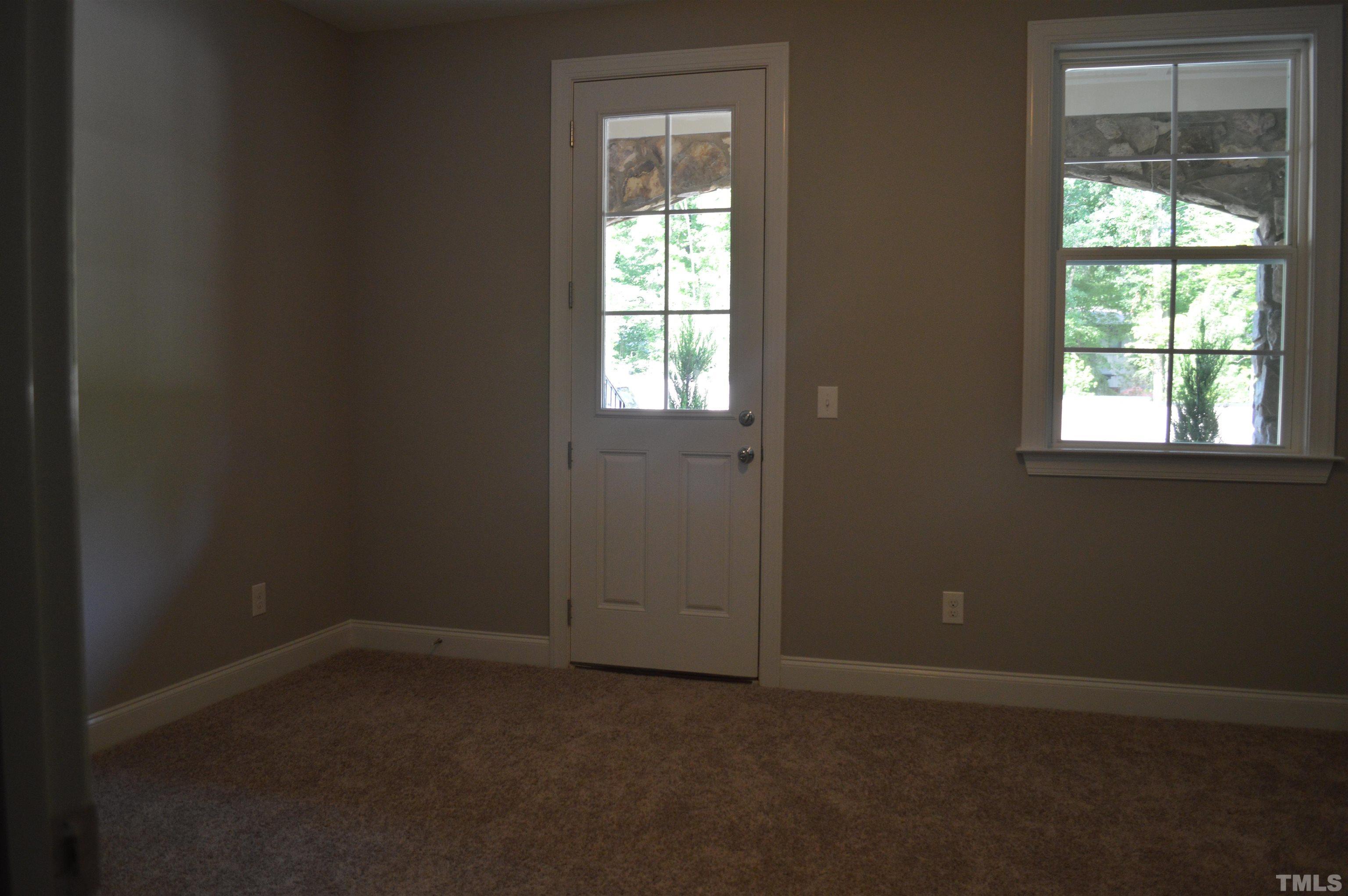 849 Wake Towne Drive Raleigh, NC 27609 - Photo 16 of 17 an empty room with a window
