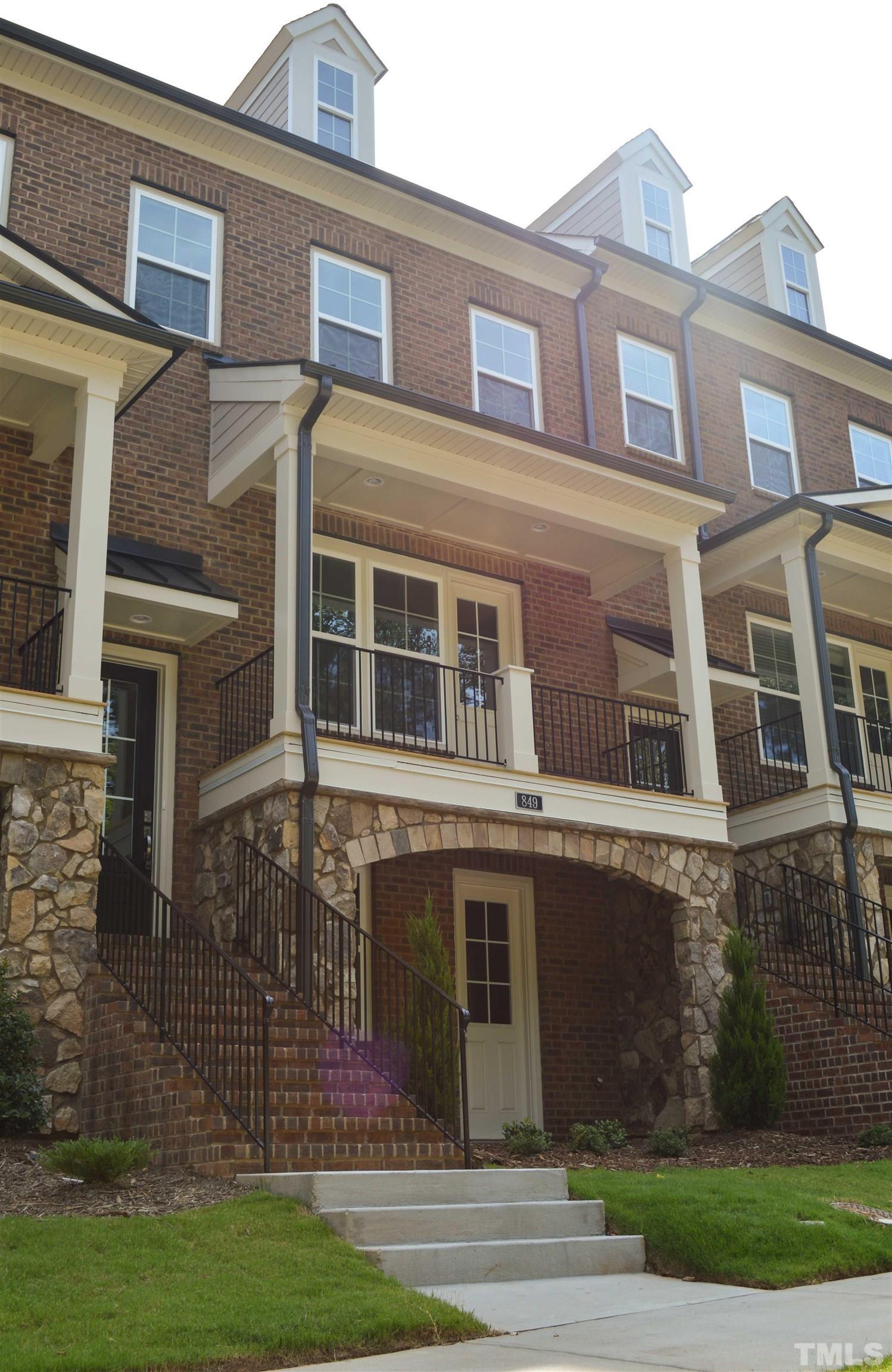849 Wake Towne Drive Raleigh, NC 27609 - Photo 2 of 17 a view of a building with a yard