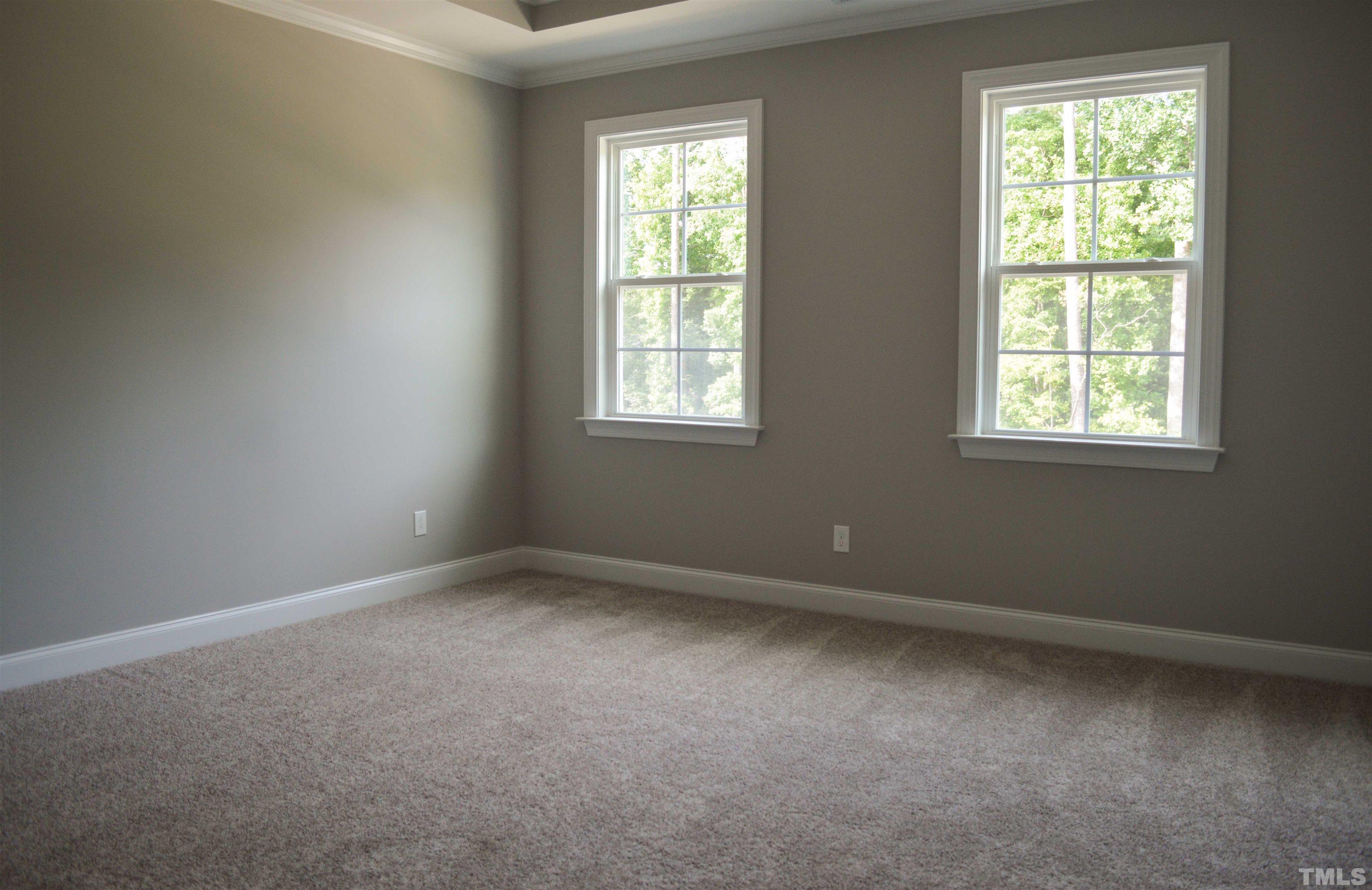 849 Wake Towne Drive Raleigh, NC 27609 - Photo 8 of 17 an empty room with a window