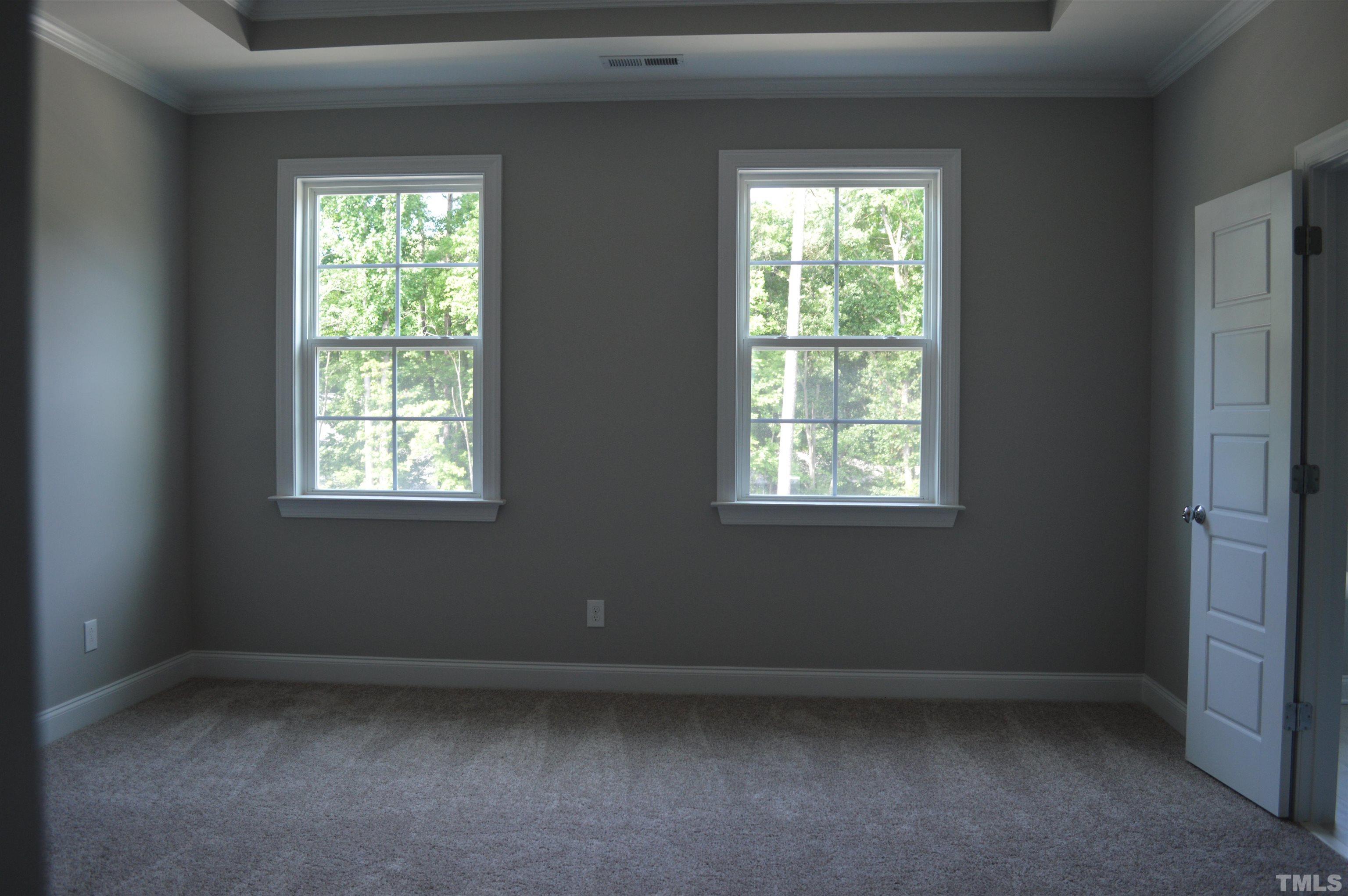 849 Wake Towne Drive Raleigh, NC 27609 - Photo 9 of 17 an empty room with a window