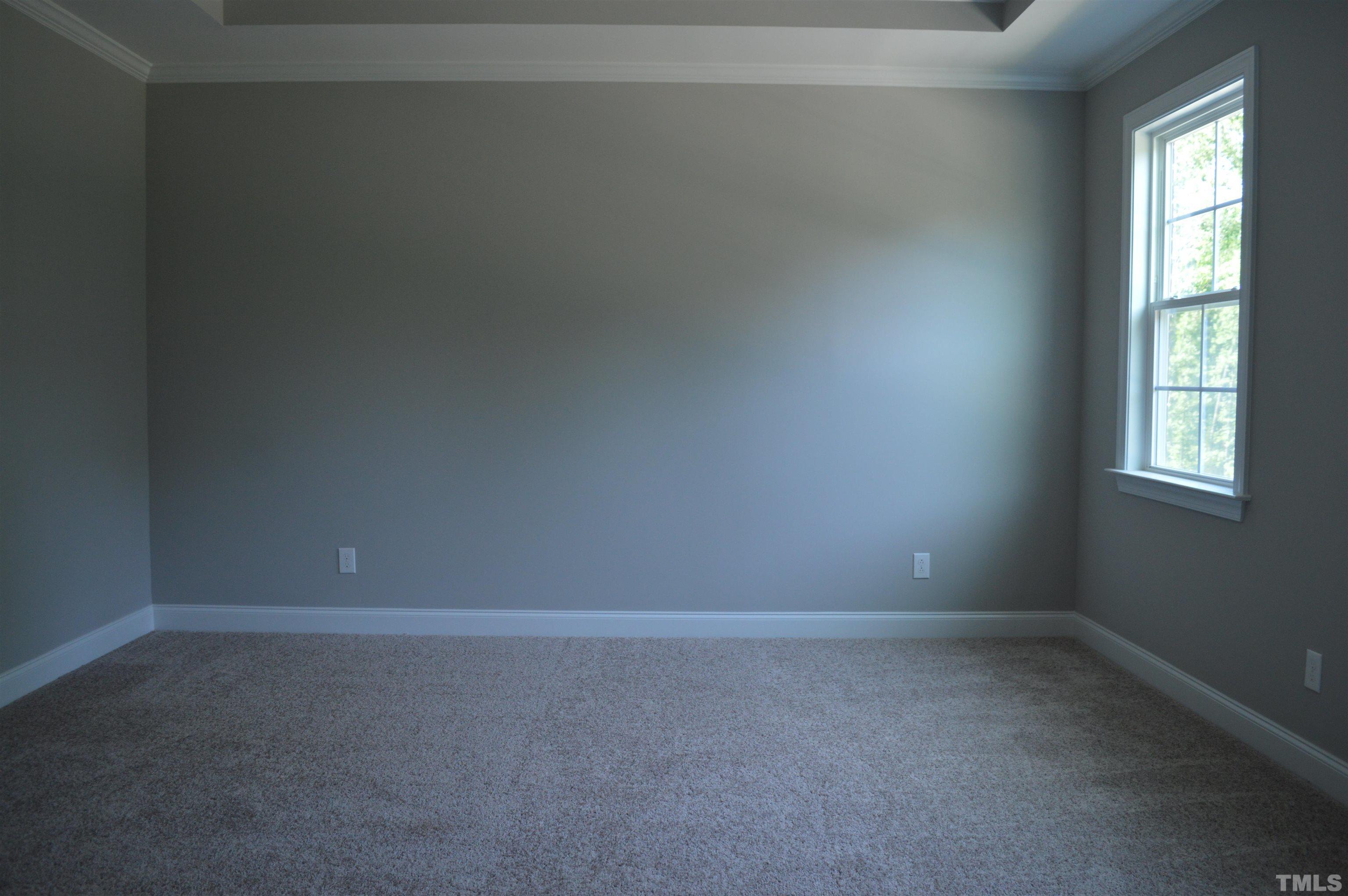 849 Wake Towne Drive Raleigh, NC 27609 - Photo 10 of 17 a room that has a window in it