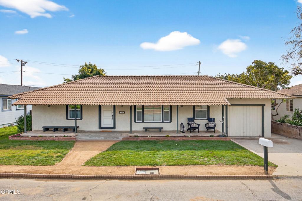 75 Neish Street Camarillo, CA 93010 - Photo 1 of 1 a front view of a house with a yard table and chairs