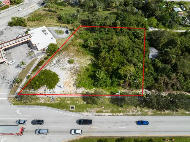 an aerial view of a residential houses with outdoor space