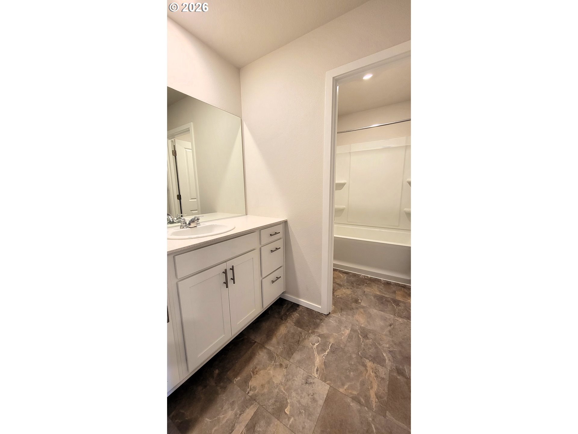 2960 V Street Springfield, OR 97477 - Photo 17 of 27 a spacious bathroom with a double vanity sink and mirror