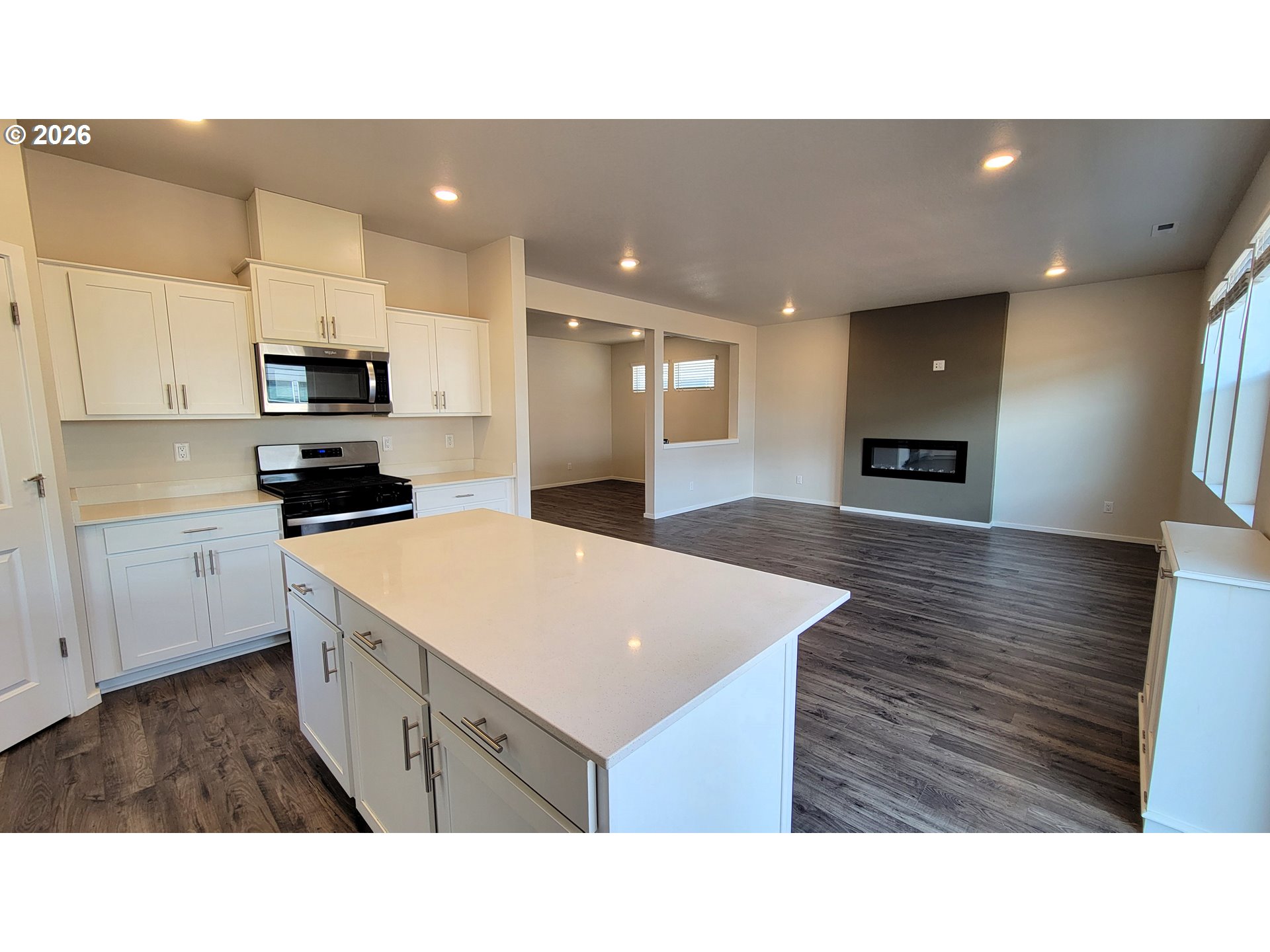 2960 V Street Springfield, OR 97477 - Photo 7 of 27 a kitchen with a sink a microwave and cabinets