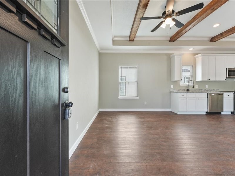 21500 Ruth Drive New Caney, TX 77357 - Photo 3 of 9 a view of a kitchen with a sink and dishwasher kitchen view with wooden floor