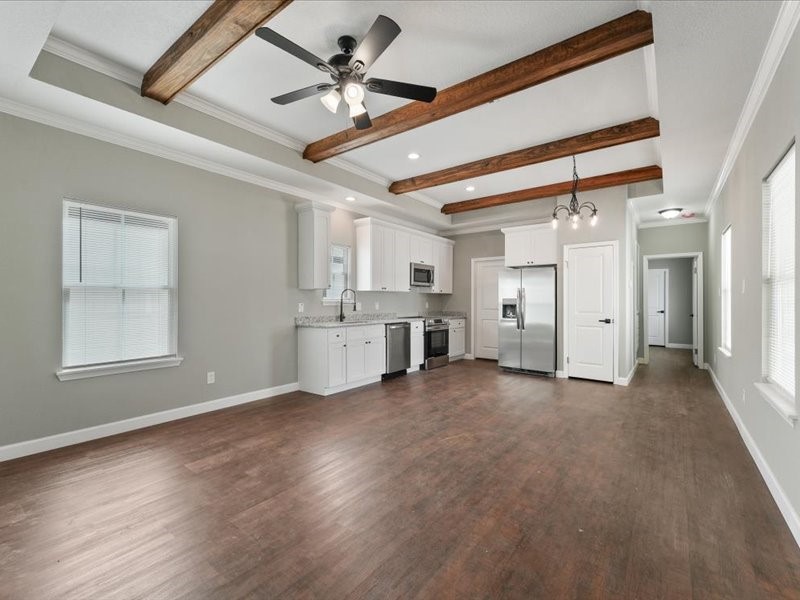 21500 Ruth Drive New Caney, TX 77357 - Photo 4 of 9 a view of empty room with wooden floor and ceiling fan