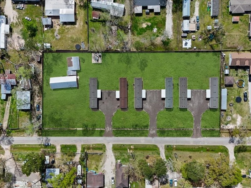 21500 Ruth Drive New Caney, TX 77357 - Photo 9 of 9 an aerial view of a house with a yard and lake view