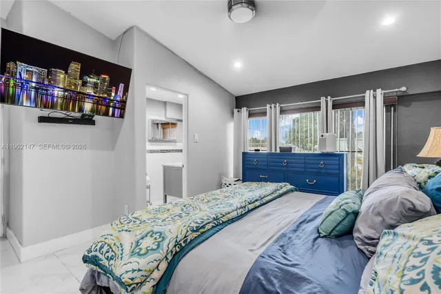 a bedroom with a bed and a book shelf