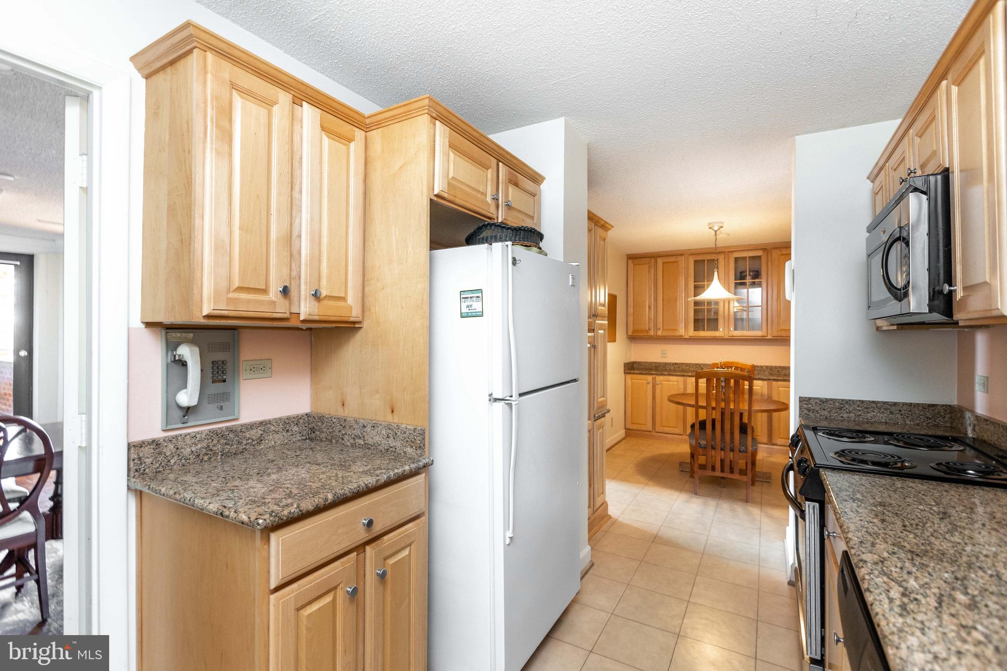 111 Hamlet Hill Road, Unit 906 Baltimore, MD 21210 - Photo 12 of 28 Newer cabinets and granite counters