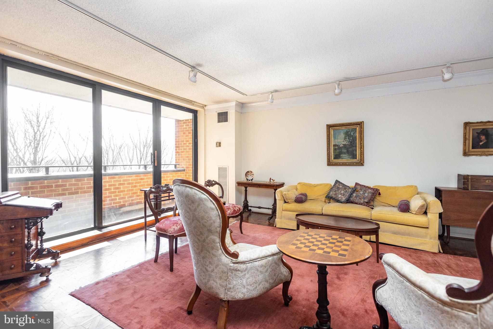 111 Hamlet Hill Road, Unit 906 Baltimore, MD 21210 - Photo 5 of 28 Enormous living room balcony access