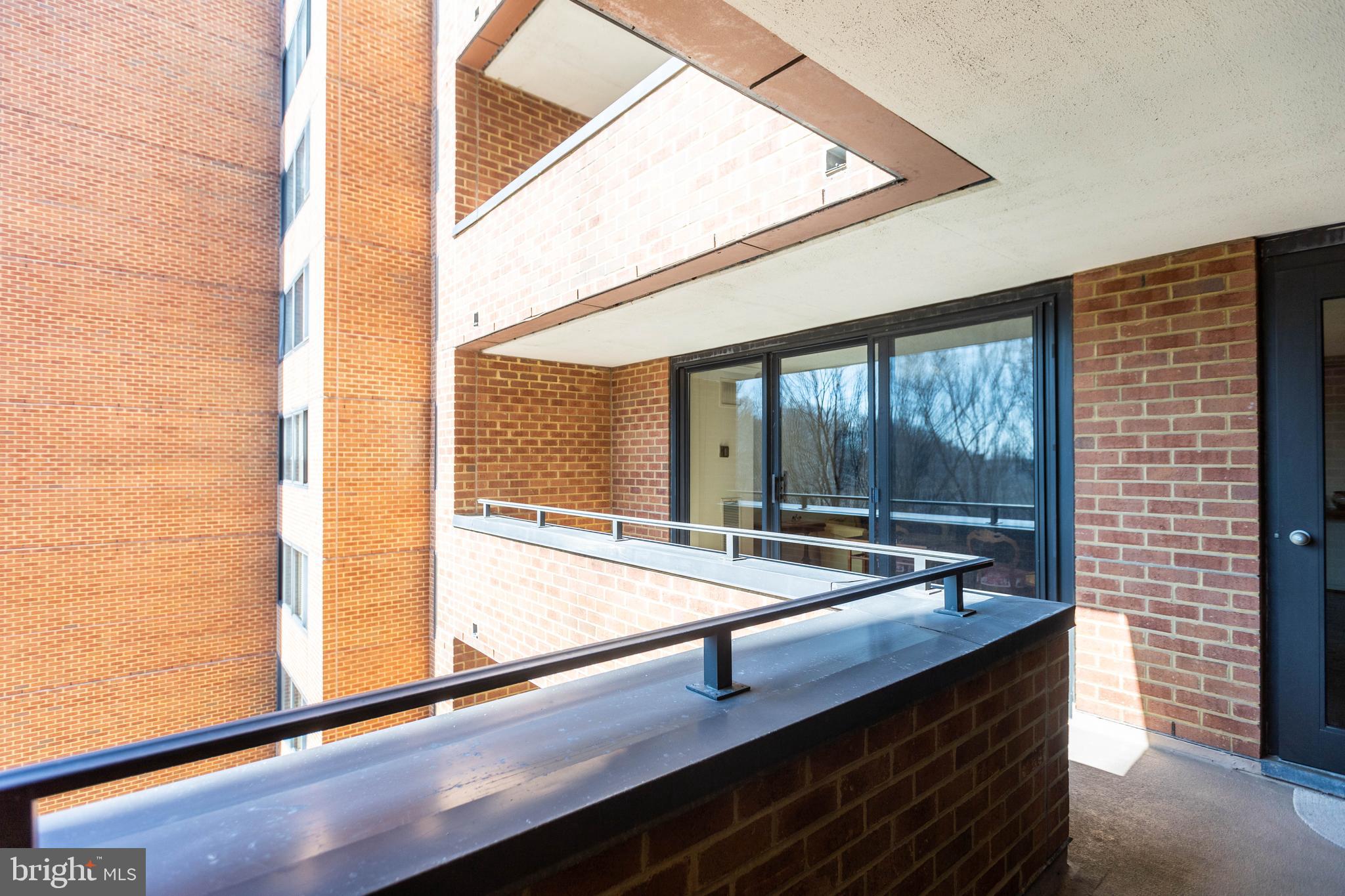 111 Hamlet Hill Road, Unit 906 Baltimore, MD 21210 - Photo 8 of 28 Balcony accessible from living room and bedroom