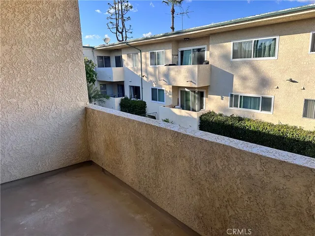 a balcony with wooden floor