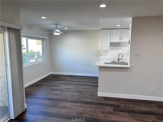 a kitchen with a sink cabinets and window
