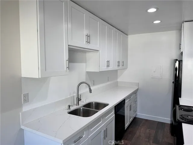 a kitchen with a stove and a refrigerator