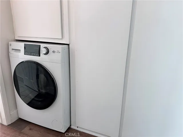 a white toilet sitting next to a bath tub