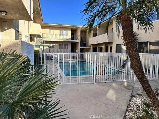 a view of a swimming pool with a patio