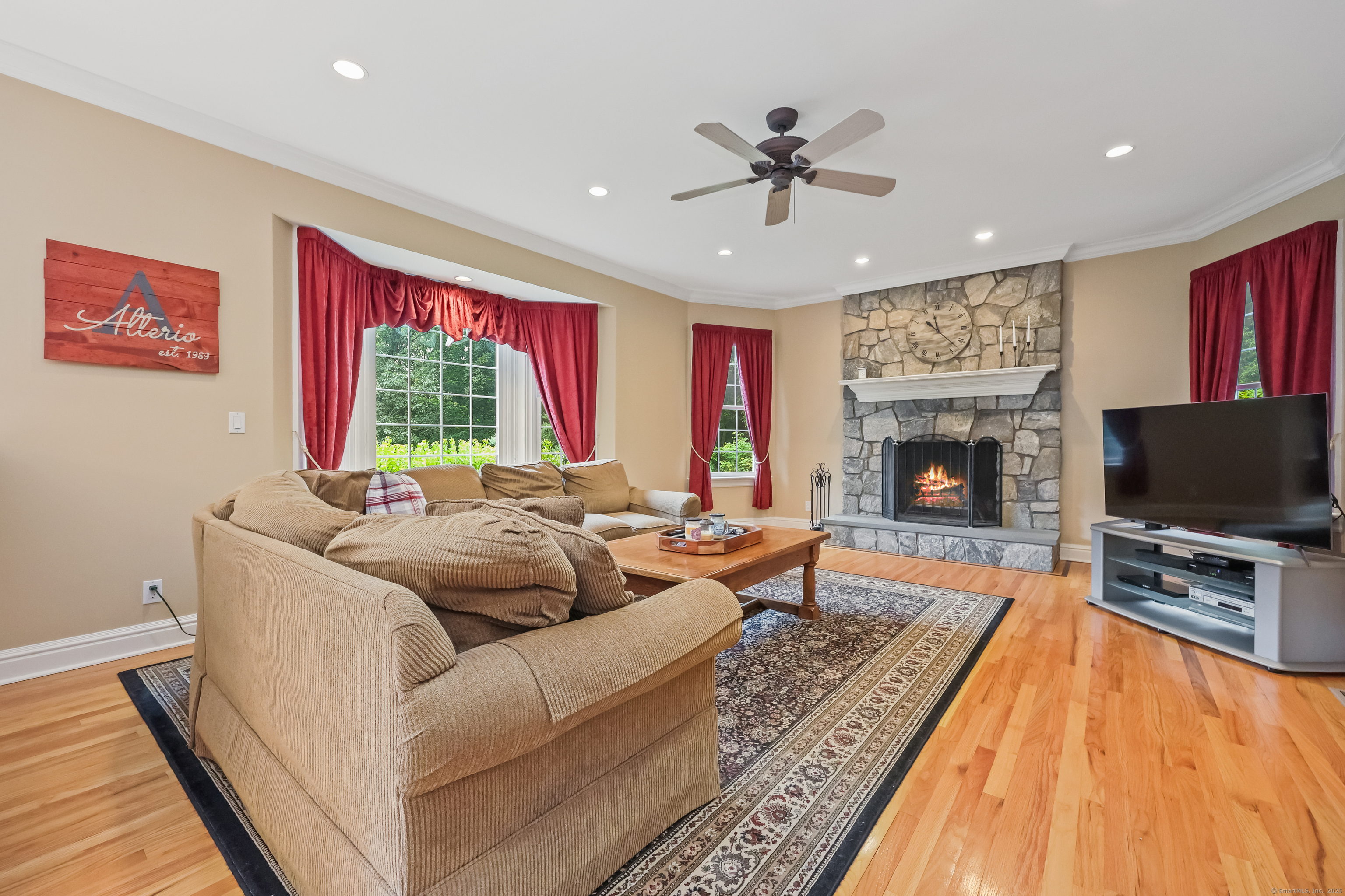 28 Sunnyview Drive Redding, CT 06896 - Photo 12 of 38 a living room with furniture and a flat screen tv