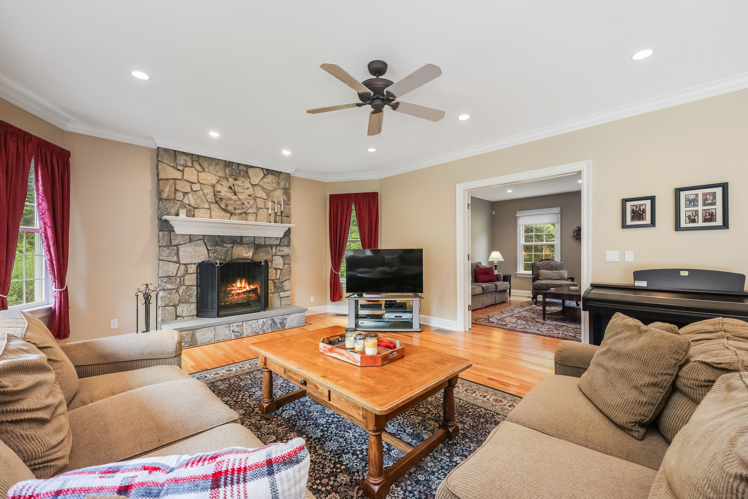 28 Sunnyview Drive Redding, CT 06896 - Photo 13 of 38 a living room with furniture and a fireplace