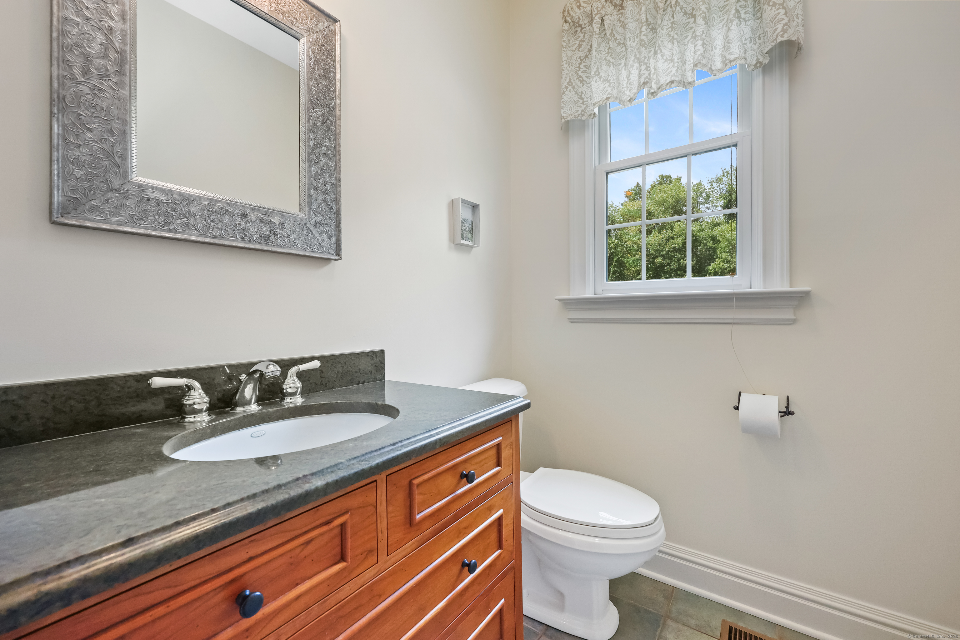 28 Sunnyview Drive Redding, CT 06896 - Photo 15 of 38 a bathroom with a granite countertop sink and a toilet
