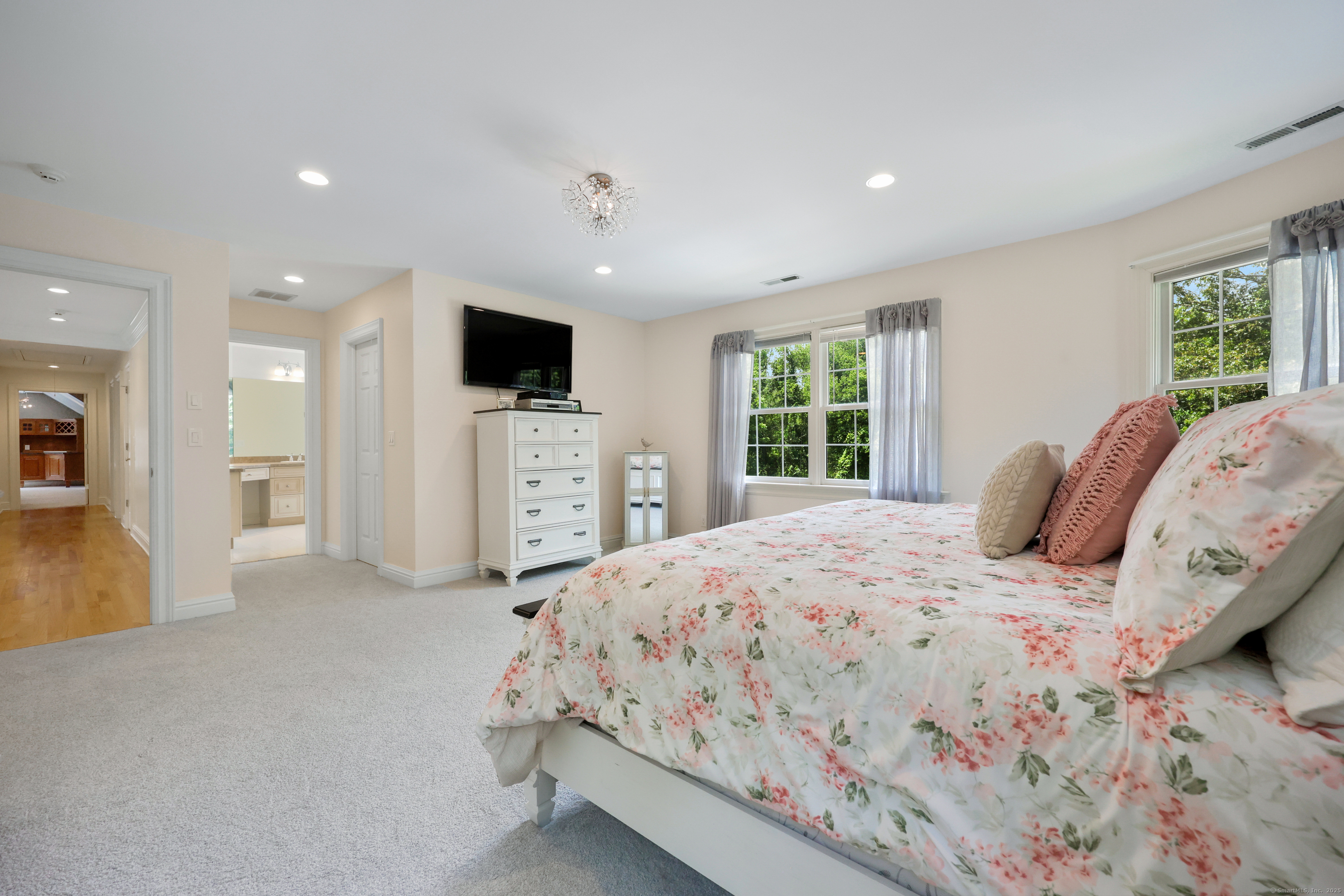 28 Sunnyview Drive Redding, CT 06896 - Photo 20 of 38 a bedroom with a large bed and a flat screen tv