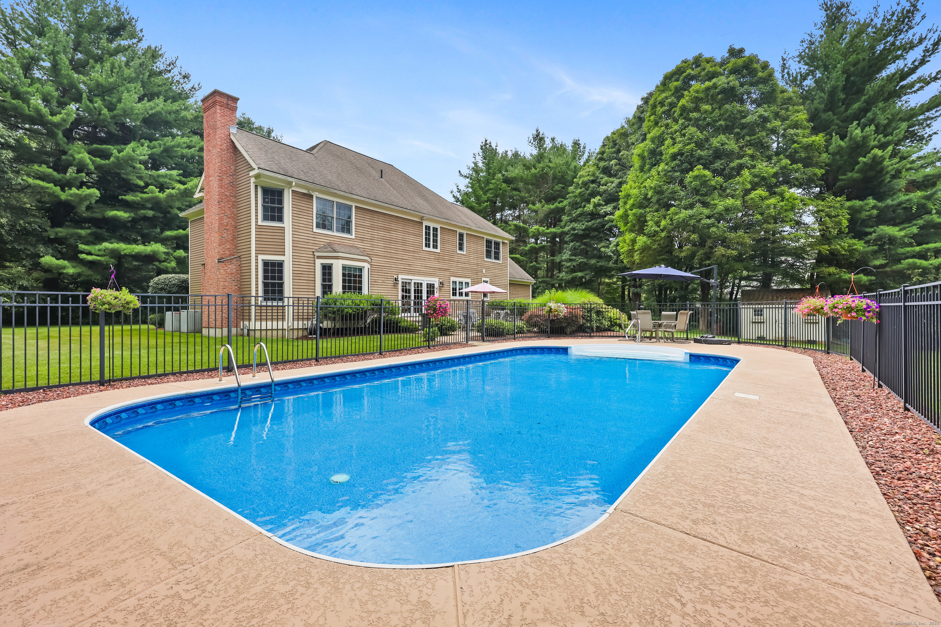 28 Sunnyview Drive Redding, CT 06896 - Photo 2 of 38 a view of swimming pool with outdoor seating and plants
