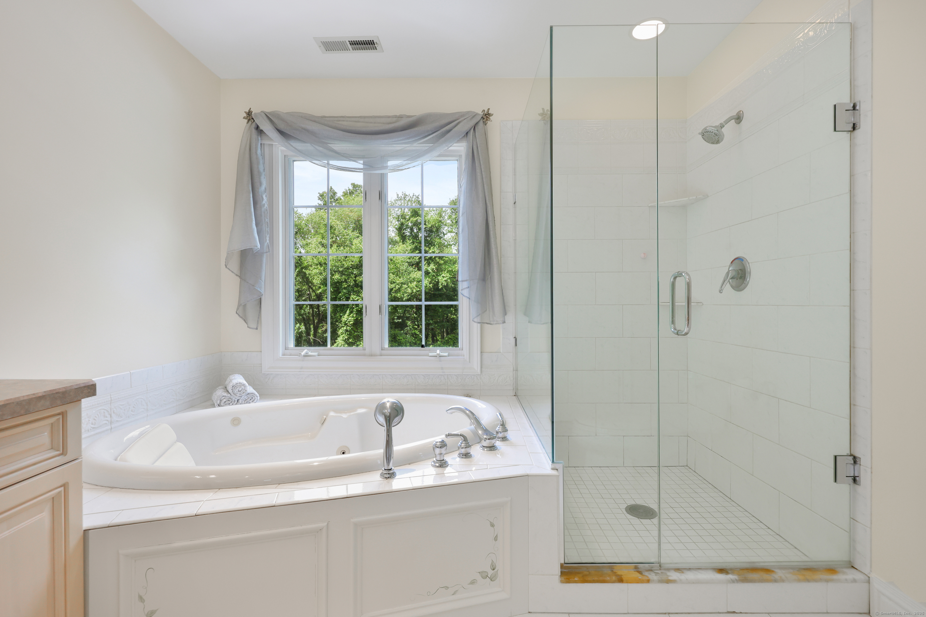 28 Sunnyview Drive Redding, CT 06896 - Photo 21 of 38 a white bath tub sitting next to a shower