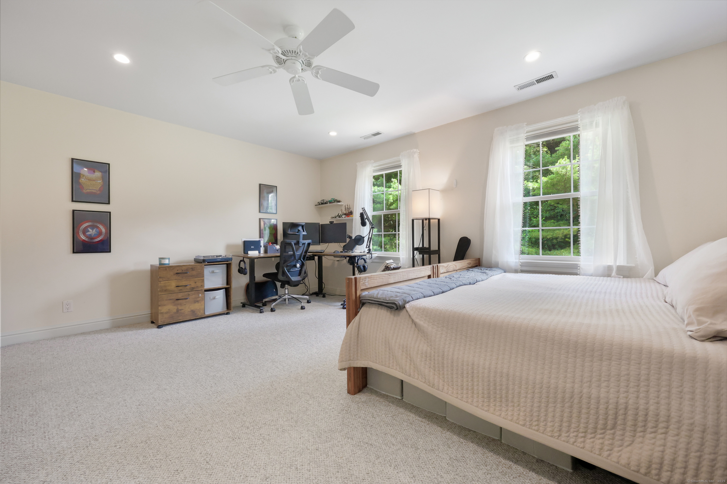 28 Sunnyview Drive Redding, CT 06896 - Photo 23 of 38 a bedroom with bed and a chandelier