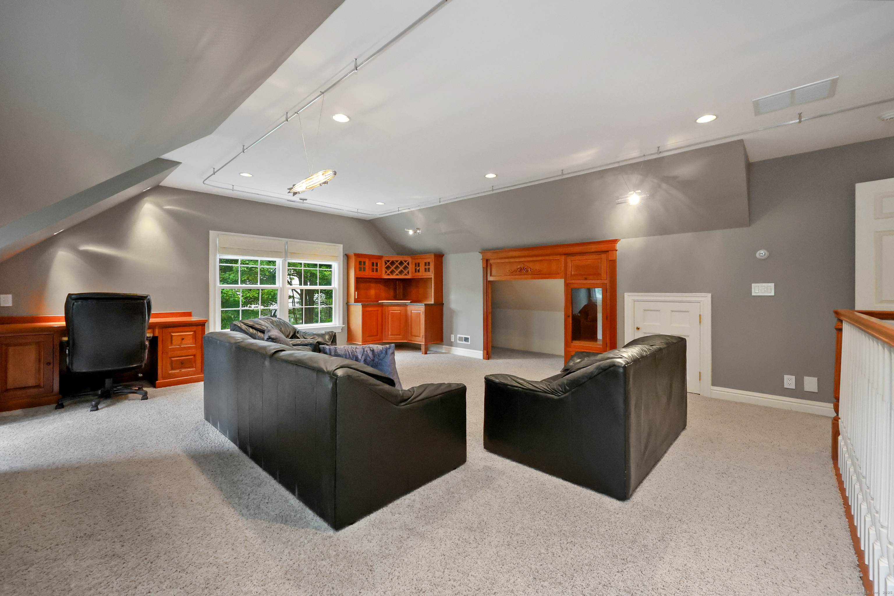 28 Sunnyview Drive Redding, CT 06896 - Photo 27 of 38 a living room with furniture and a flat screen tv