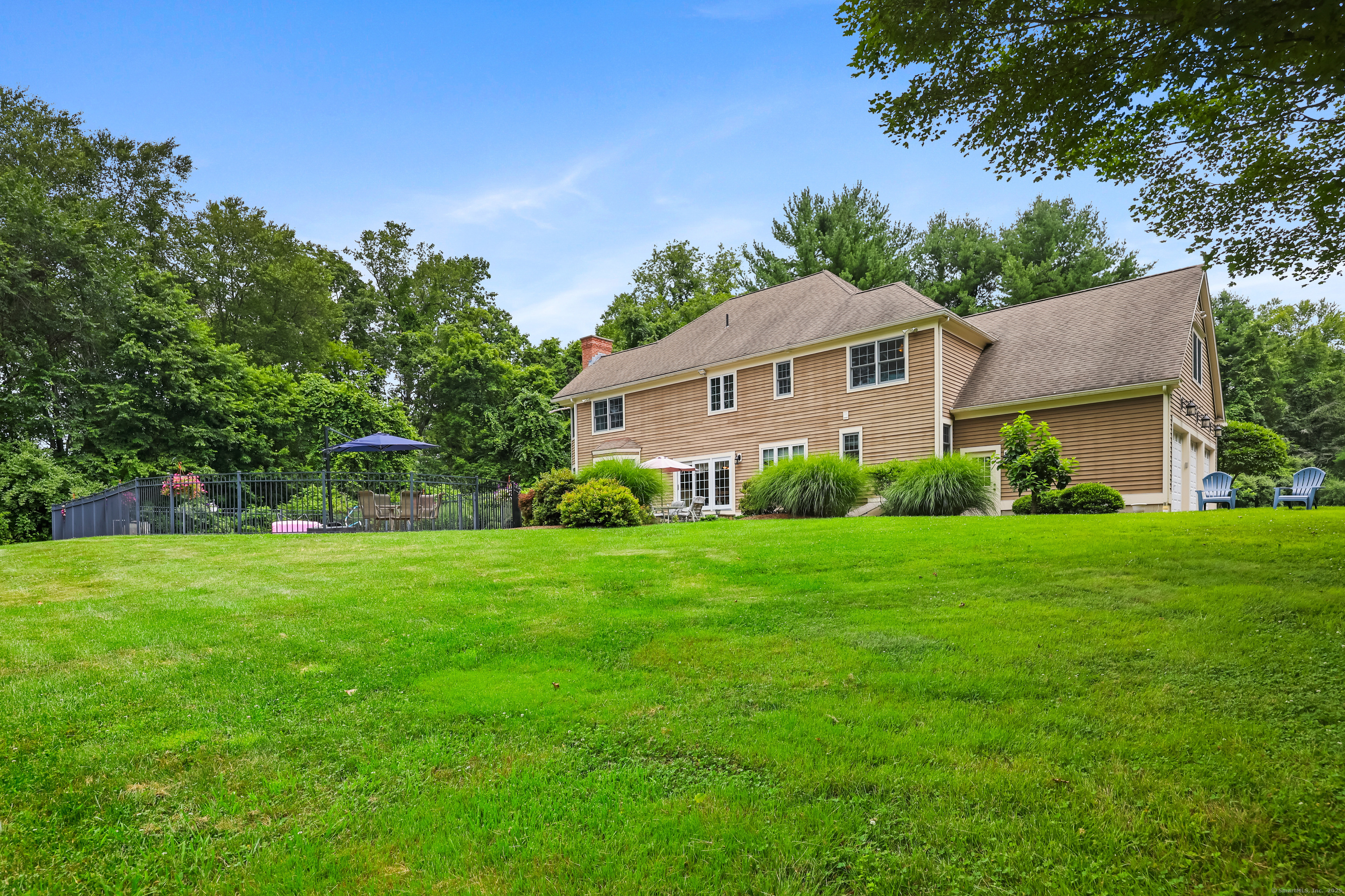 28 Sunnyview Drive Redding, CT 06896 - Photo 33 of 38 a front view of a house with a yard