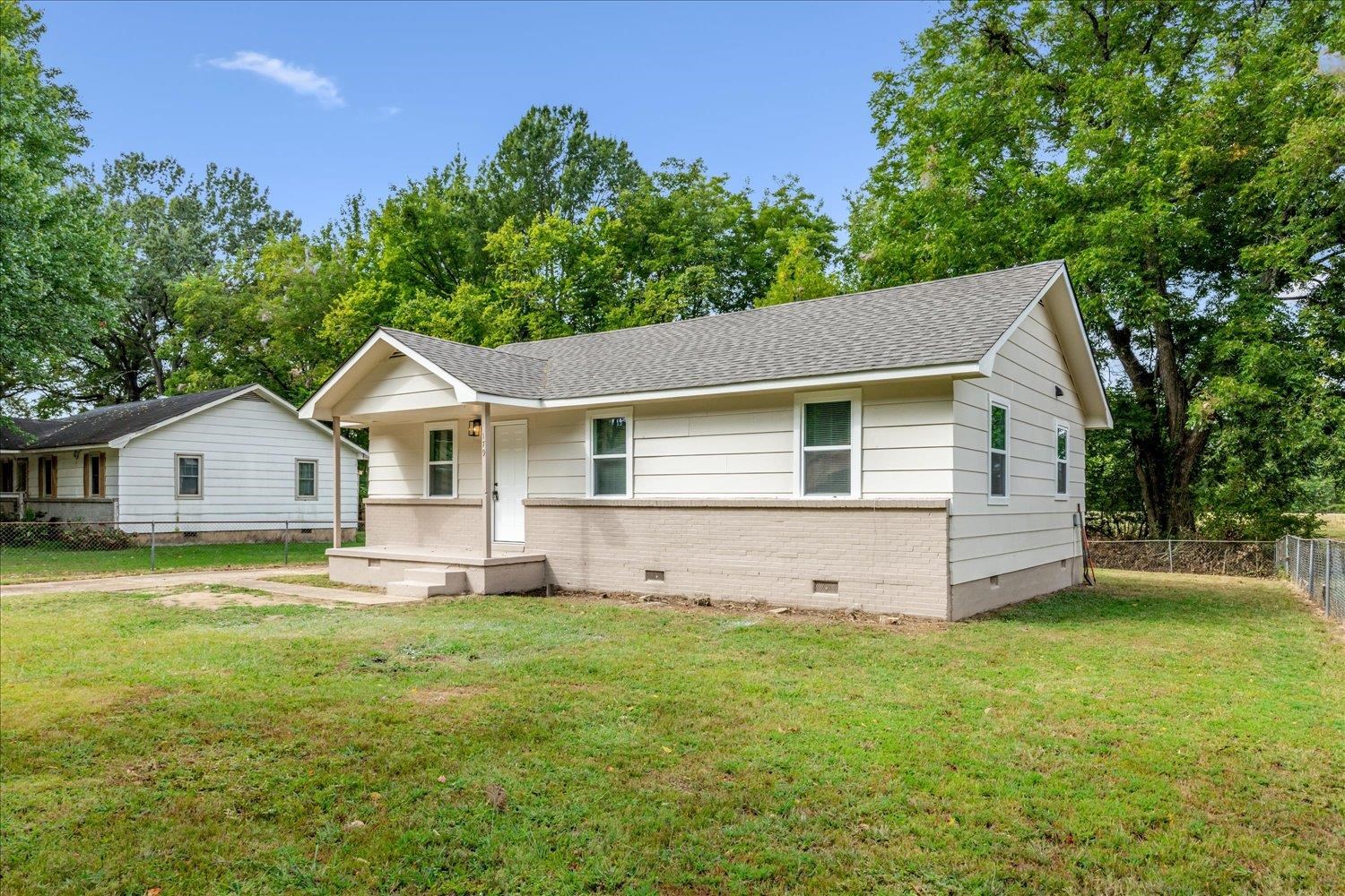 179 Harris Cove Collierville, TN 38017 - Photo 16 of 25 View of front of property featuring crawl space, a porch, roof with shingles, and brick siding